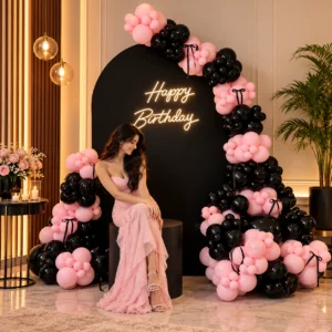 sweet pink and black birthday arch decor